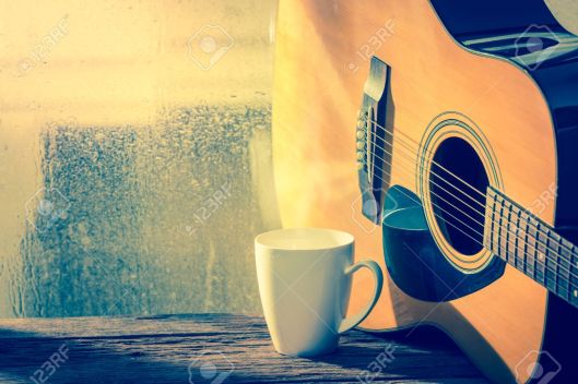 Coffee cup with acoustic guitar